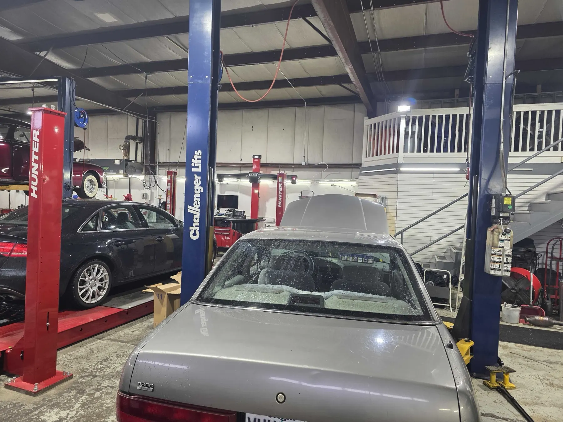 Toyota sedan up on the two-post lift at Rob's Automotive Repair Center in Clackamas, Oregon