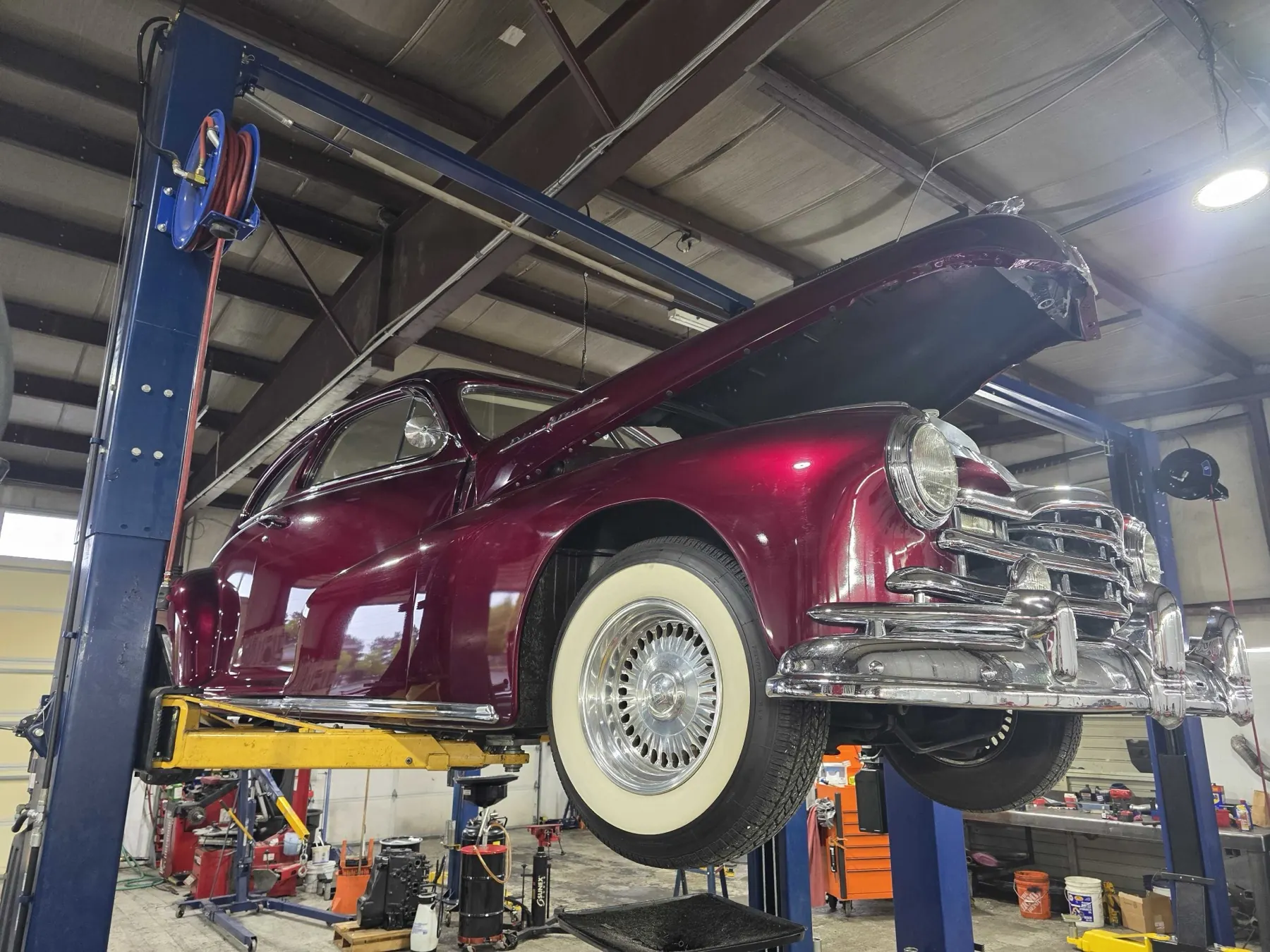 Classic Plymouth on the two-post lift at Rob's Automotive Repair Center in Clackamas, Oregon — we service all makes & models, vintage to modern
